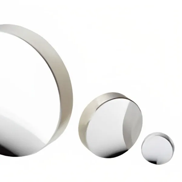 Three metallic mirrors of different sizes on white