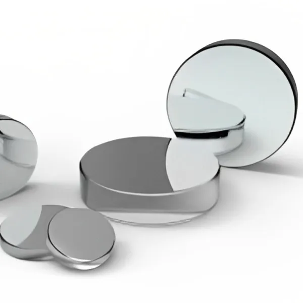 Concave mirrors of several sizes on white