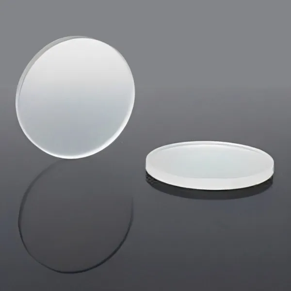 Two round diffuser discs, one standing and one lying flat