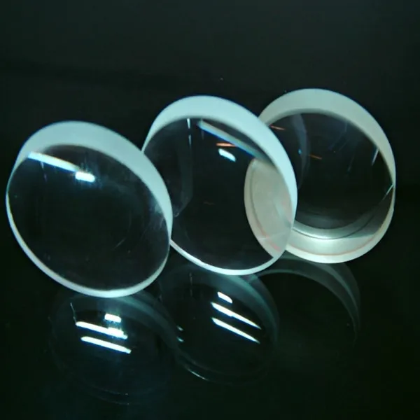 Three double-concave lenses on a dark background