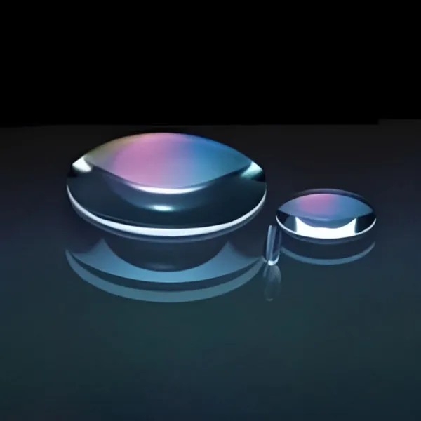 Two double-convex lenses on a dark background with coloured reflections