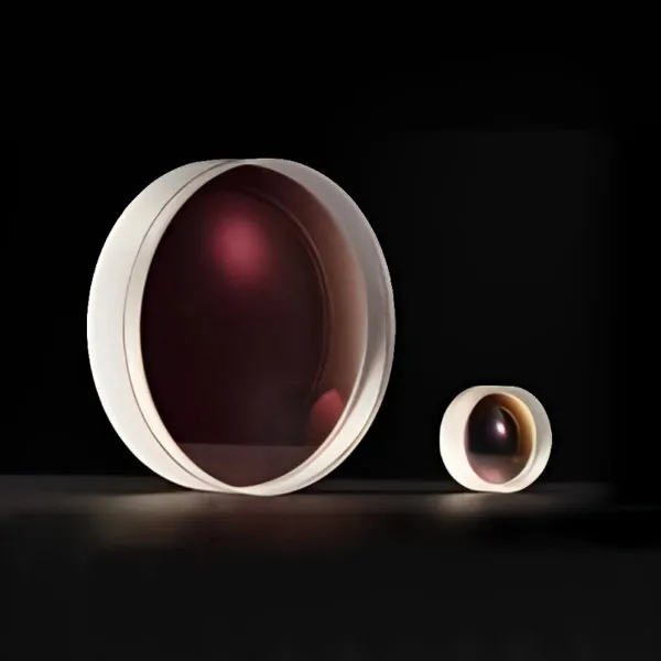 Two negative achromatic lenses on black, one large and one small