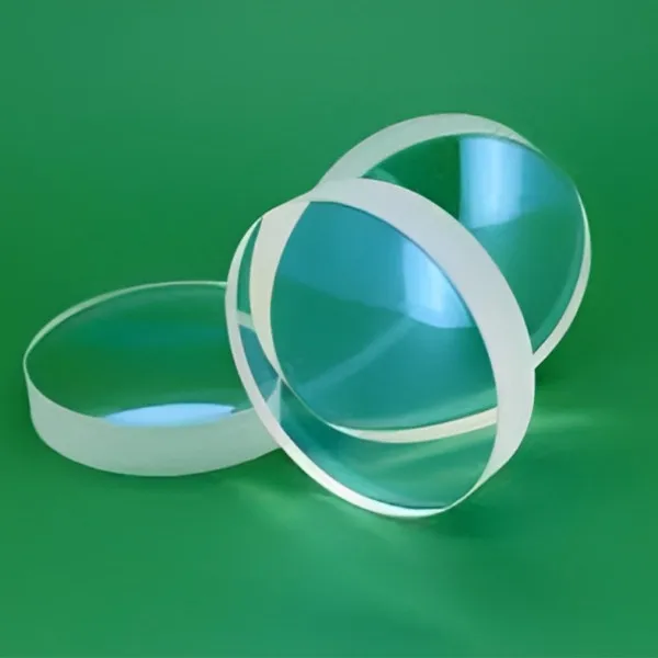 Three plano-convex lenses on a green background