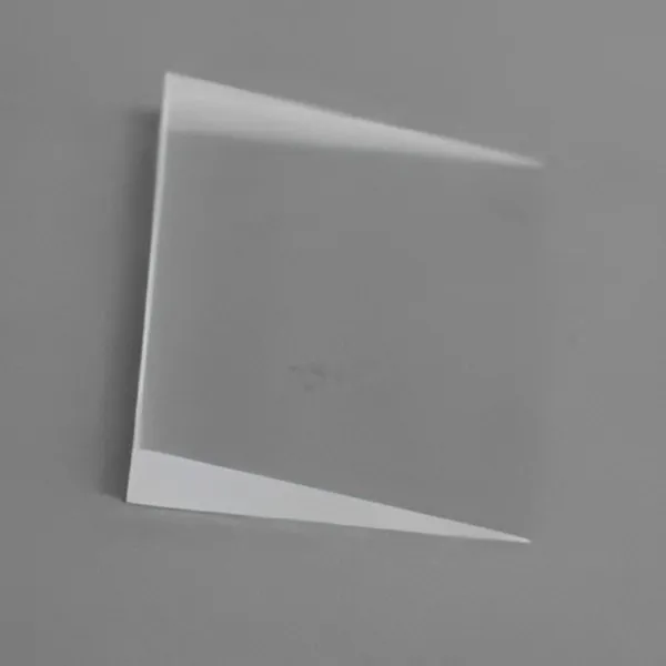 Thin wedge prism on a grey background